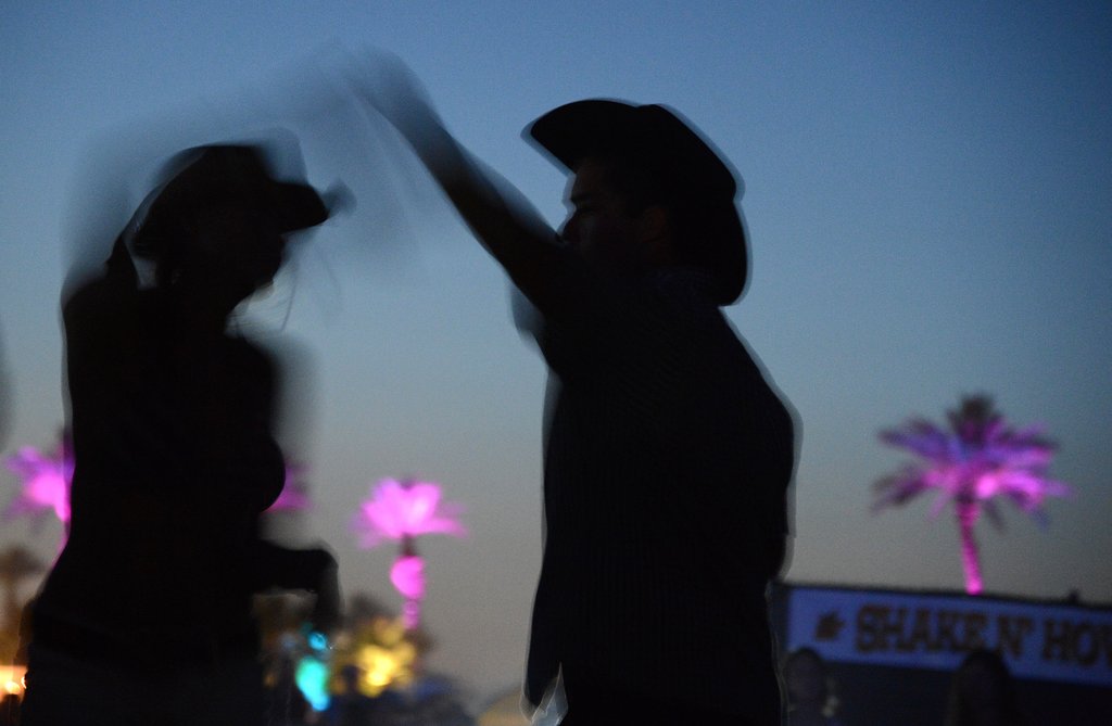 A couple danced to country tunes at the Stagecoach music festival.
A couple danced to country tunes at the Stagecoach music festival.