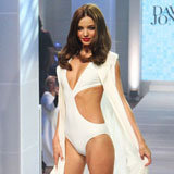 Miranda Kerr Shows Skin in a White Cutout Swimsuit Miranda Kerr Shows Skin in a White Cutout Swimsuit