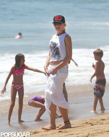 Gwen Stefani wore a white skirt and cropped tank top on the beach.
Gwen Stefani wore a white skirt and cropped tank top on the beach.