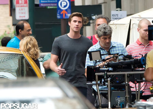 Liam Hemsworth wore a gray t-shirt on set.
Liam Hemsworth wore a gray t-shirt on set.