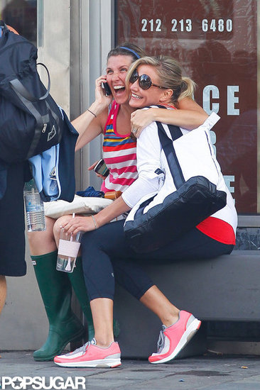 Cameron Diaz cozied up to a friend outside the gym. Cameron Diaz cozied up to a friend outside the gym.