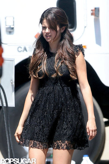 Selena Gomez wore a black lace dress on the set of Feed the Dog.
Selena Gomez wore a black lace dress on the set of Feed the Dog.