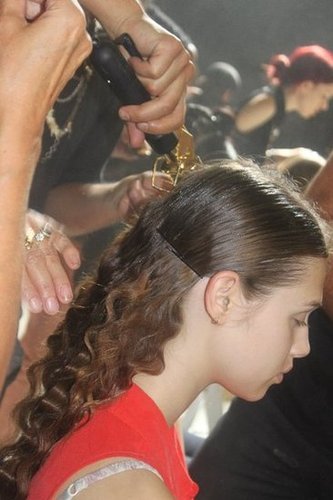 Lead hairstylist Odile Gilbert used a three-barreled iron to create romantic crimped waves in the back. A modern middle part was gelled and Kérastase Paris Elixir Ultime The Imperial provided an extreme shine.
Lead hairstylist Odile Gilbert used a three-barreled iron to create romantic crimped waves in the back. A modern middle part was gelled and Kérastase Paris Elixir Ultime The Imperial provided an extreme shine.