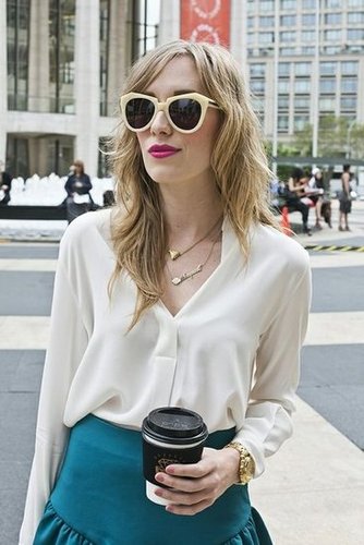 With her cat-eye sunglasses, bold lip hue, and tousled hair, this woman's beauty look was the epitome of cool.
Photo by Caroline Voagen Nelson
With her cat-eye sunglasses, bold lip hue, and tousled hair, this woman's beauty look was the epitome of cool.
Photo by Caroline Voagen Nelson