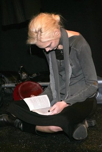 A cross-legged model read a book backstage at the Alice Roi Fall 2006 fashion show during New York Fashion Week.
A cross-legged model read a book backstage at the Alice Roi Fall 2006 fashion show during New York Fashion Week.