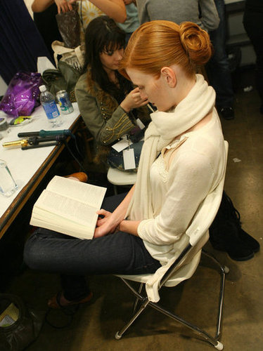 A model focused on her book backstage during LA Fashion Week in 2007.
A model focused on her book backstage during LA Fashion Week in 2007.
