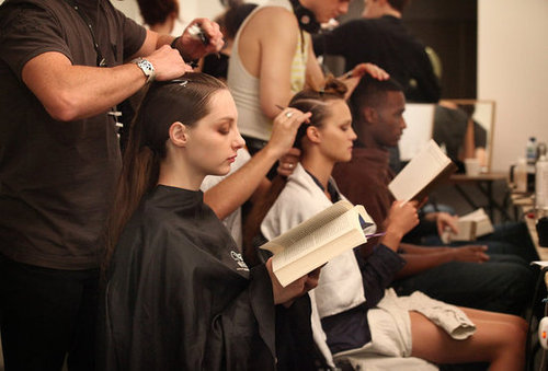 Models busied themselves with books during prep for their London fashion show in 2010.
Models busied themselves with books during prep for their London fashion show in 2010.