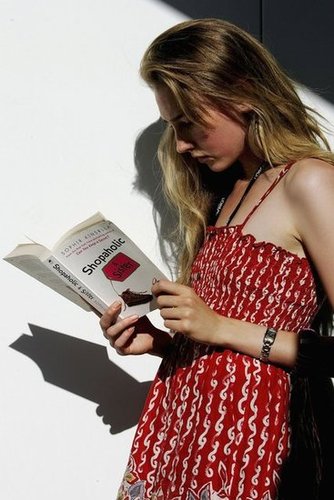 A pretty model read Sophie Kinsella's Shopaholic & Sister in the sun during Melbourne's Fashion Week in 2006.
A pretty model read Sophie Kinsella's Shopaholic & Sister in the sun during Melbourne's Fashion Week in 2006.