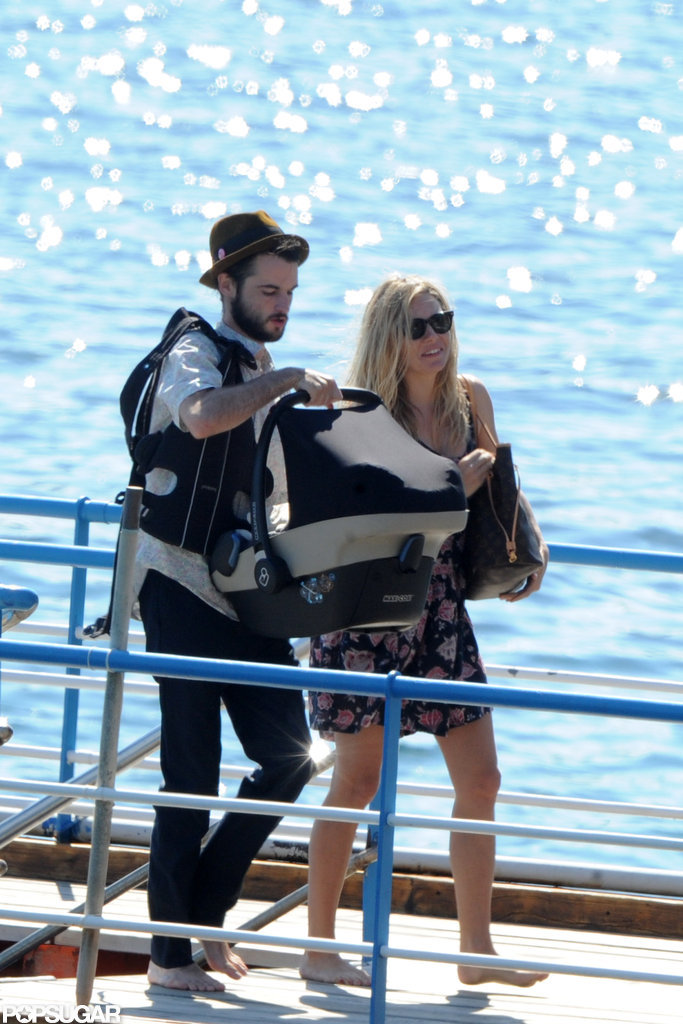 Tom Sturridge and Sienna Miller carried baby Marlowe off of a boat in her carrier.
Tom Sturridge and Sienna Miller carried baby Marlowe off of a boat in her carrier.