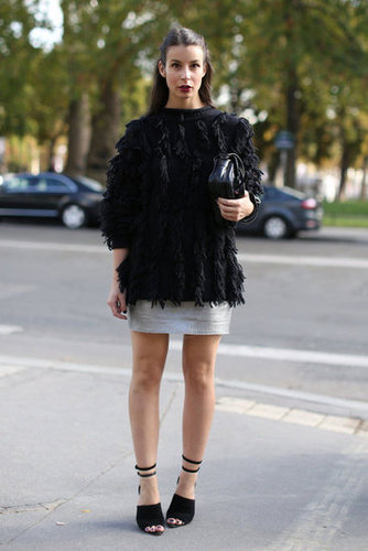 Street glam, courtesy of a fur topper, metallic mini, and a pair of strappy heels.
Street glam, courtesy of a fur topper, metallic mini, and a pair of strappy heels.