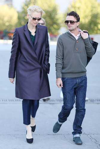 Tilda Swinton balanced tailored trousers with an architectural, jewel-toned coat.
Tilda Swinton balanced tailored trousers with an architectural, jewel-toned coat.