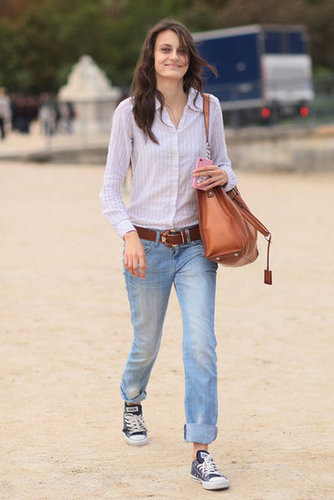 A tucked-in buttonup and slick bag offset the casual feel of a cuffed boyfriend jean-and-Converse combo.
A tucked-in buttonup and slick bag offset the casual feel of a cuffed boyfriend jean-and-Converse combo.