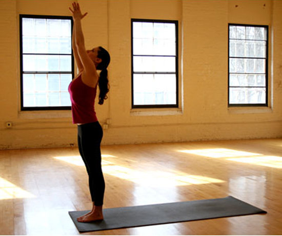 Inhale as you raise your arms up overhead and gaze at your palms.
Inhale as you raise your arms up overhead and gaze at your palms.