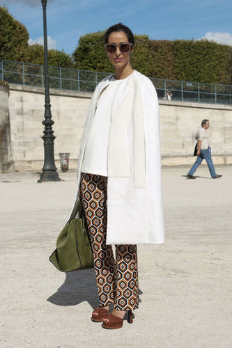 An ultrachic finish on a pair of printed pants with a minimalist white car coat and '70s-inspired platforms.
An ultrachic finish on a pair of printed pants with a minimalist white car coat and '70s-inspired platforms.