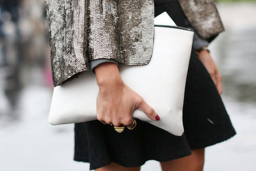 We love the contrast of sequins and a sleek white clutch.
We love the contrast of sequins and a sleek white clutch.