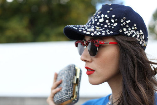 A baseball hat brimming with sequins and rhinestone-embellished red shades meant real fashion fun.
A baseball hat brimming with sequins and rhinestone-embellished red shades meant real fashion fun.