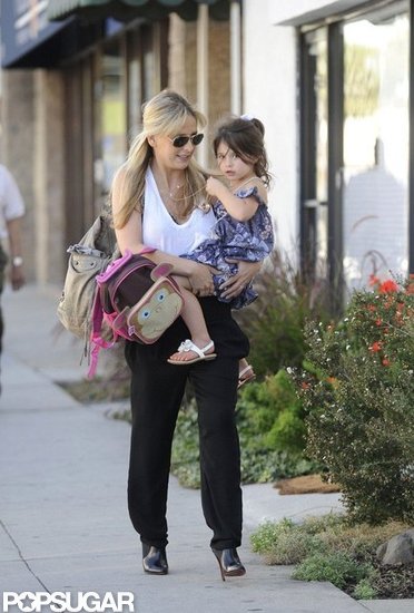 Sarah Michelle Gellar carried Charlotte Prinze, who wore a purple dress and ponytail.
Sarah Michelle Gellar carried Charlotte Prinze, who wore a purple dress and ponytail.