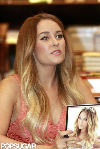 Lauren Conrad held a copy of her book.
Lauren Conrad held a copy of her book.