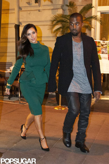 Kim Kardashian and Kanye West held hands as they walked. Kim Kardashian and Kanye West held hands as they walked.