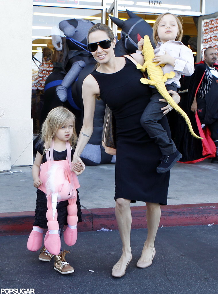 Angelina Jolie carried Knox Jolie-Pitt on her hip as she made her way out of a Halloween store in LA with Vivienne Jolie-Pitt and Shiloh Jolie-Pitt in October 2012.
Angelina Jolie carried Knox Jolie-Pitt on her hip as she made her way out of a Halloween store in LA with Vivienne Jolie-Pitt and Shiloh Jolie-Pitt in October 2012.
