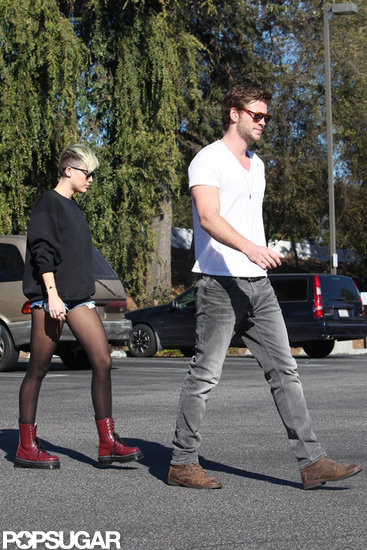 Miley Cyrus wore red boots for an outing with Liam Hemsworth in LA.
Miley Cyrus wore red boots for an outing with Liam Hemsworth in LA.