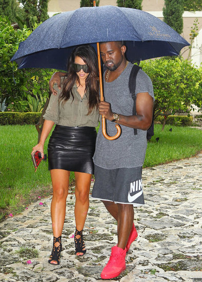 Kanye West held onto Kim Kardashian and an umbrella while they were out in Miami in October 2012.
Kanye West held onto Kim Kardashian and an umbrella while they were out in Miami in October 2012.