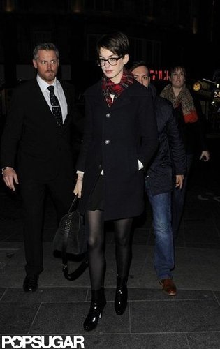 Anne Hathaway kept warm in a coat.
Anne Hathaway kept warm in a coat.