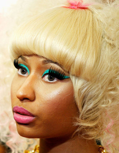 People can't seem to get enough of Nicki's signature style: fluorescent shadow, heaving false lashes, and a pop of pink lipstick. The fringe looks pretty amazing too.
People can't seem to get enough of Nicki's signature style: fluorescent shadow, heaving false lashes, and a pop of pink lipstick. The fringe looks pretty amazing too.