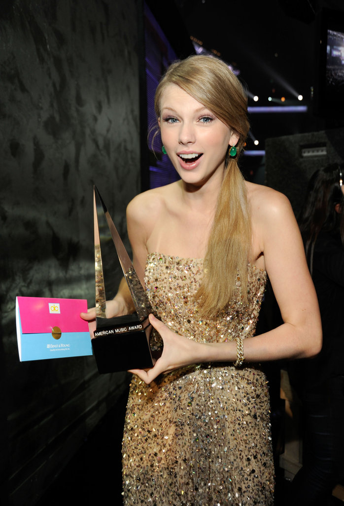 Taylor Swift held on to her American Music Award while backstage at the event in November 2011.
Taylor Swift held on to her American Music Award while backstage at the event in November 2011.