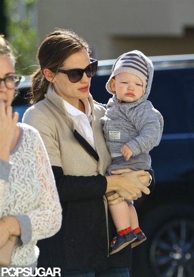 Samuel Affleck hitched a ride on his mom's hip. Samuel Affleck hitched a ride on his mom's hip.