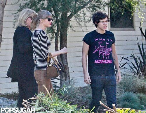 Harry Styles and Taylor Swift stood outside her LA home.
Harry Styles and Taylor Swift stood outside her LA home.