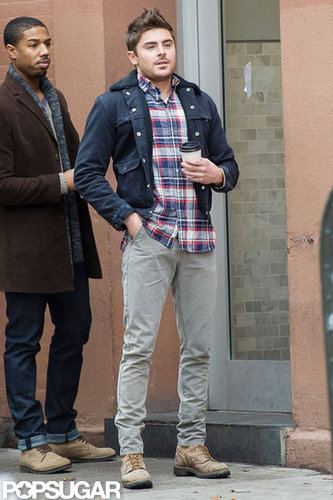 Zac Efron held on to a cup of coffee while filming.
Zac Efron held on to a cup of coffee while filming.