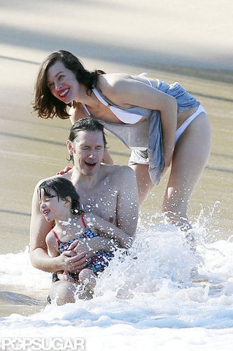 Bikini-Clad Milla Jovovich Poses Beachside With Her Family on NYE Bikini-Clad Milla Jovovich Poses Beachside With Her Family on NYE