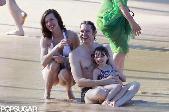 Bikini-Clad Milla Jovovich Poses Beachside With Her Family on NYE Bikini-Clad Milla Jovovich Poses Beachside With Her Family on NYE