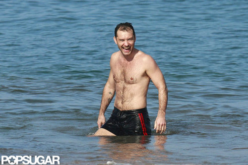 Jude Law waded in the waves.
Jude Law waded in the waves.