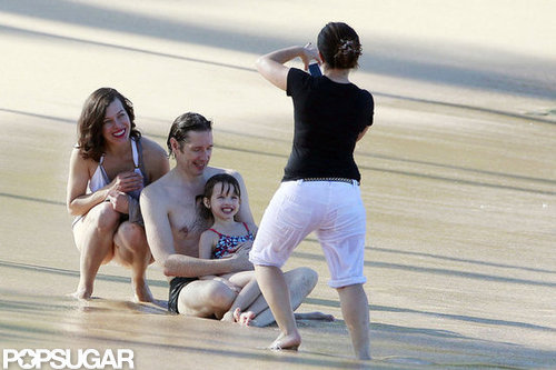Milla Jovovich and her family posed for a beach photo.
Milla Jovovich and her family posed for a beach photo.