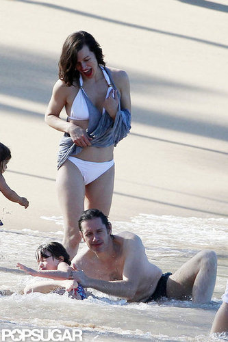Bikini-Clad Milla Jovovich Poses Beachside With Her Family on NYE Bikini-Clad Milla Jovovich Poses Beachside With Her Family on NYE