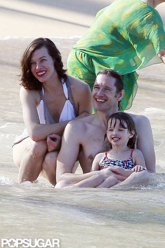 Bikini-Clad Milla Jovovich Poses Beachside With Her Family on NYE Bikini-Clad Milla Jovovich Poses Beachside With Her Family on NYE