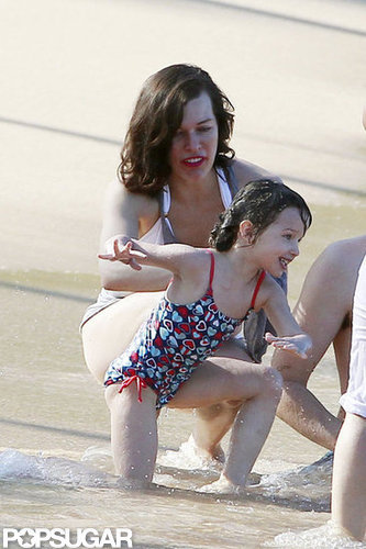 Bikini-Clad Milla Jovovich Poses Beachside With Her Family on NYE Bikini-Clad Milla Jovovich Poses Beachside With Her Family on NYE