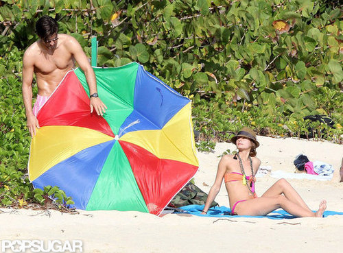 Olivia Palermo's boyfriend, Johanne Huebl, tried to fix their broken beach umbrella.
Olivia Palermo's boyfriend, Johanne Huebl, tried to fix their broken beach umbrella.