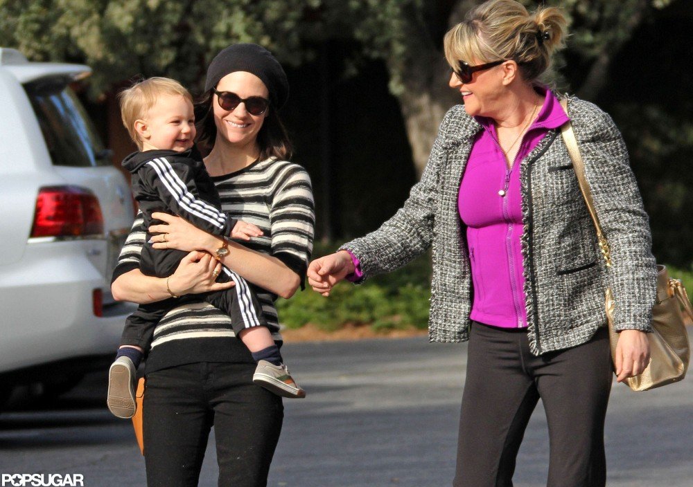 January Jones carried Xander for a stroll in LA with her mom, Karen. January Jones carried Xander for a stroll in LA with her mom, Karen.