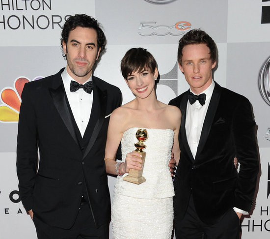 Anne Hathaway posed with Eddie Redmayne, Sacha Baron Cohen, and her Golden Globe.
Anne Hathaway posed with Eddie Redmayne, Sacha Baron Cohen, and her Golden Globe.