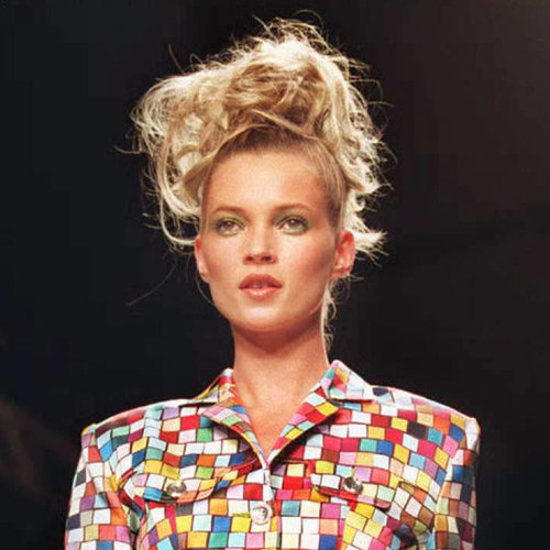 Walking in a runway show in 1995, Kate was in her '90s glory with wild hair and emerald green eye shadow.
Walking in a runway show in 1995, Kate was in her '90s glory with wild hair and emerald green eye shadow.