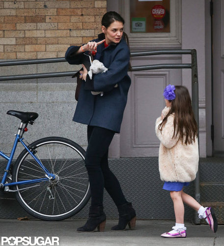Katie Has Her Hands Full During Chilly Outing With Suri Katie Has Her Hands Full During Chilly Outing With Suri