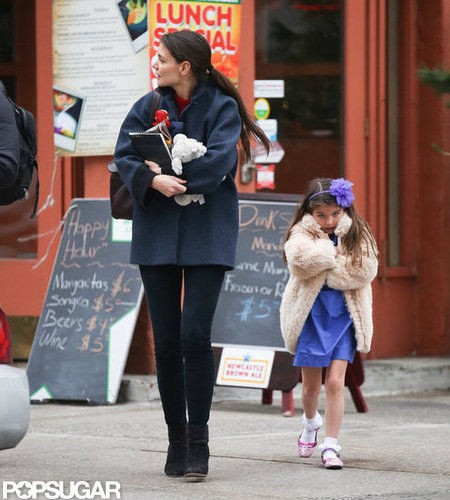 Katie Holmes wore a Balenciaga coat while she walked with Suri Cruise.
Katie Holmes wore a Balenciaga coat while she walked with Suri Cruise.