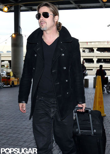 Brad Pitt wheeled his luggage into LAX.
Brad Pitt wheeled his luggage into LAX.