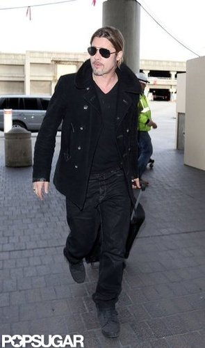 Brad Pitt wore his sunglasses as he arrived at LAX.
Brad Pitt wore his sunglasses as he arrived at LAX.