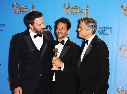 Ben Affleck met up with his producing partners Grant Heslov and George Clooney in the press room at the Golden Globes.
Ben Affleck met up with his producing partners Grant Heslov and George Clooney in the press room at the Golden Globes.