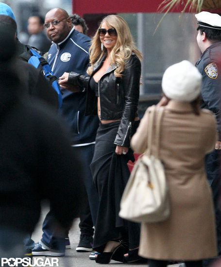 Mariah Carey flashed her stomach while walking around NYC. Mariah Carey flashed her stomach while walking around NYC.