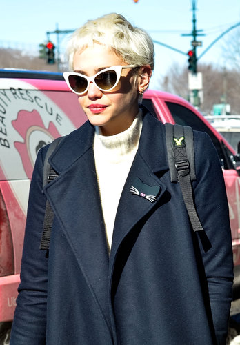 A bleached pixie cut got the vintage treatment with cat-eye sunglasses and beautiful peach lipstick.
A bleached pixie cut got the vintage treatment with cat-eye sunglasses and beautiful peach lipstick.